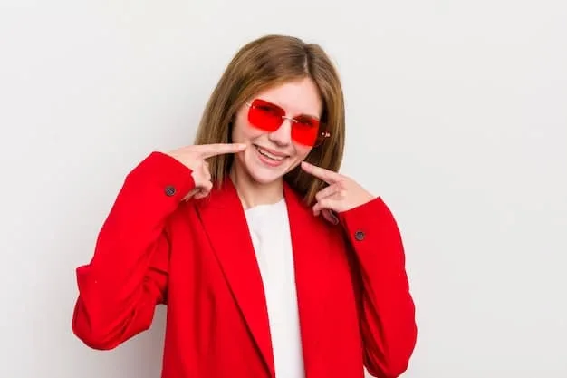 A person with a heart-shaped face smiling while wearing sleek aviator sunglasses, showcasing how the frame's shape balances the wider forehead and narrower chin. The photo is taken outdoors in natural light.