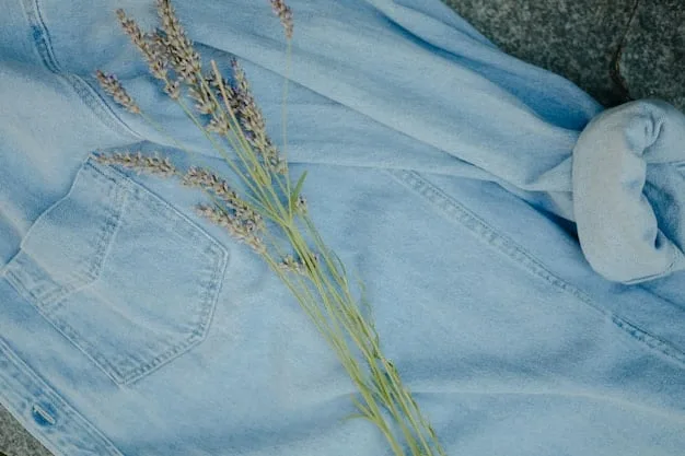 A detailed flat lay of various sustainable fashion items: a pair of organic cotton jeans, a re-purposed silk scarf, a linen shirt, and a pair of minimalist, ethically sourced leather sandals, all in natural, earthy tones.