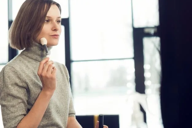 A person lightly dusting translucent setting powder onto their face with a large, fluffy powder brush, with a soft focus on the application.