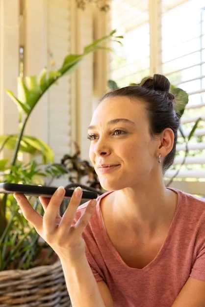 A woman applying foundation with a beauty blender in natural morning light, demonstrating proper application technique and good lighting practices.