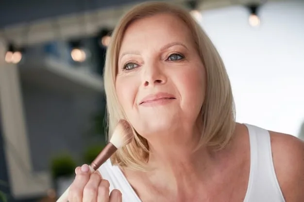 A detailed shot of a mature woman smiling, showcasing her perfectly shaped eyebrows and a soft, natural pink lip color that enhances her radiant face.