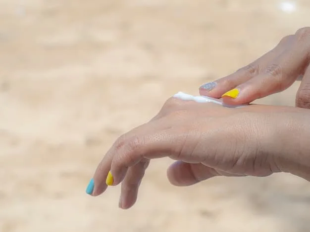 A person's hand applying a generous amount of sunscreen to their arm, with blurred beach background. Focus on the thick, even layer of sunscreen, implying proper application.