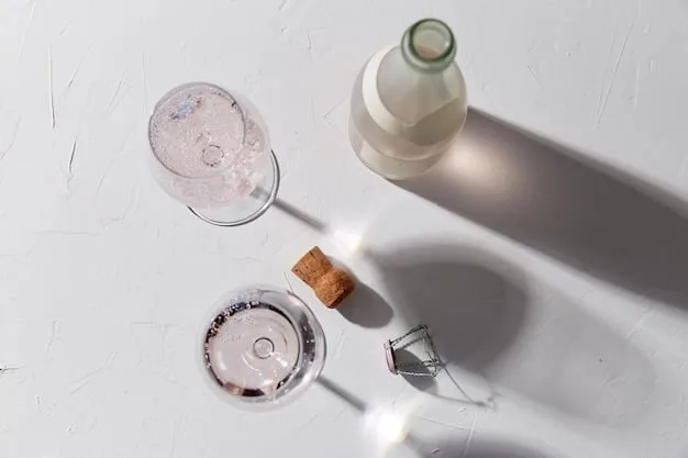 A minimalist flat lay of various skincare products, including a hyaluronic acid serum bottle, a moisturizer jar, and a facial mist, surrounded by fresh water droplets, representing a complete hydration routine.