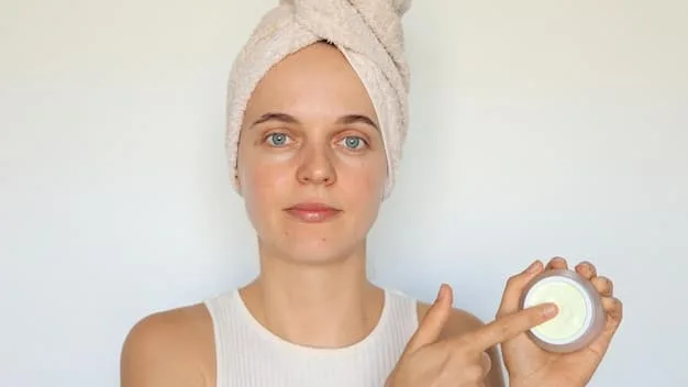 A close-up of a person applying a lightweight, gel-based moisturizer to their face, highlighting texture and gentle application.