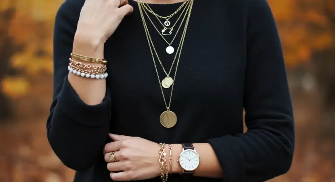 Woman showcasing layered accessories for a polished fall 2026 look