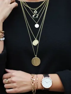 Woman showcasing layered accessories for a polished fall 2026 look