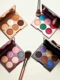 Six top eyeshadow palettes of 2026, open and displaying vibrant, blendable shades, ready for makeup application.