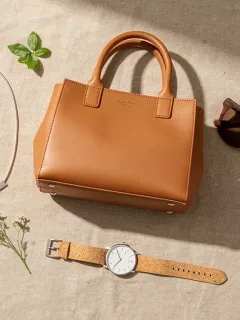 Collection of sustainable accessory brands in the US, featuring vegan leather bags and recycled jewelry