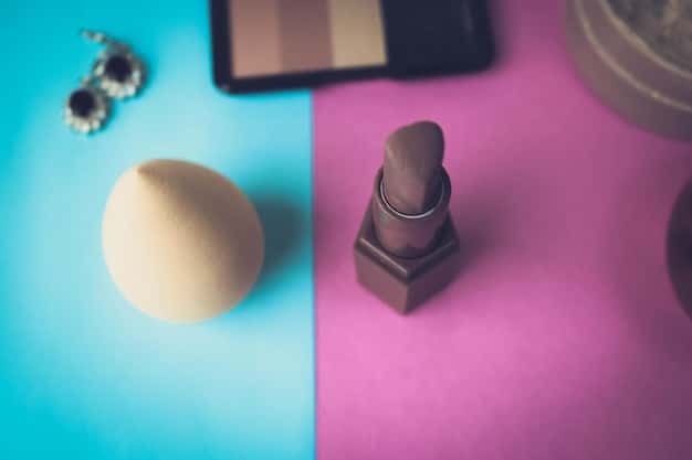A close-up of different shades of liquid foundation bottles, neatly arranged on a vanity, with a fluffy makeup brush and a beauty blender nearby.