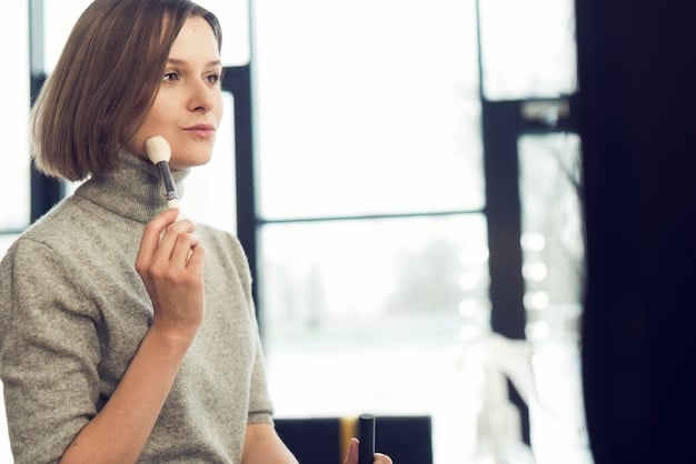 A person lightly dusting translucent setting powder onto their face with a large, fluffy powder brush, with a soft focus on the application.