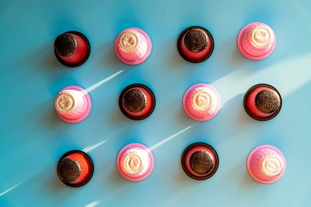 A close-up flat lay of various lipstick bullet types and liquid lipsticks, alongside lip liners and a small pot of lip scrub, all neatly arranged.