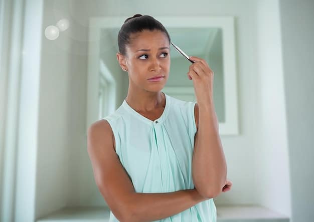 A woman meticulously shaping her eyebrows with tweezers in a well-lit vanity, focusing on individual hair removal.
