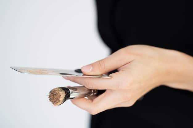 A makeup artist's hands demonstrating the application of highlight, blush, and contour on a model's face, showing the blending technique.