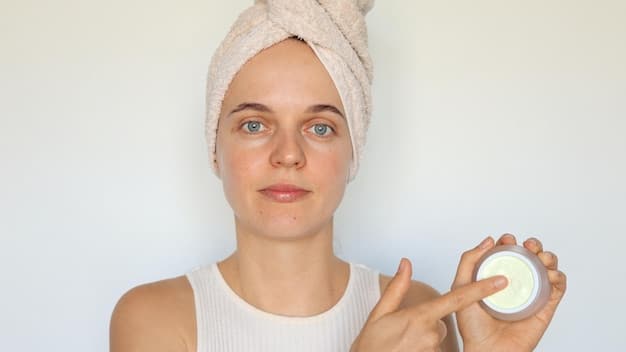 A close-up of a person applying a lightweight, gel-based moisturizer to their face, highlighting texture and gentle application.