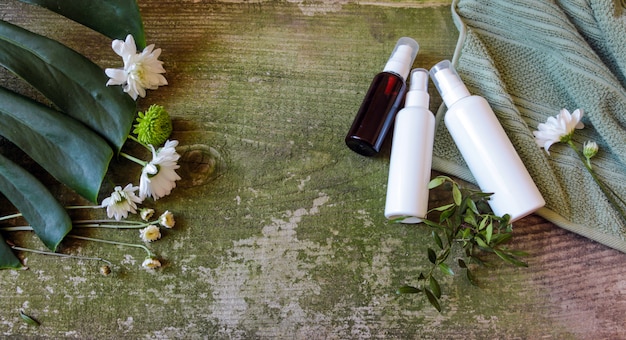 A calm, serene image of various skincare products specifically formulated for sensitive skin, such as a bottle of hyaluronic acid serum, a tub of barrier repair cream, and a gentle foaming cleanser, arranged neatly on a smooth, light-colored surface.