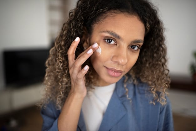 A person's hand applying a small amount of dark spot corrector cream to their cheek, focusing on a specific blemish, demonstrating precise and targeted treatment.
