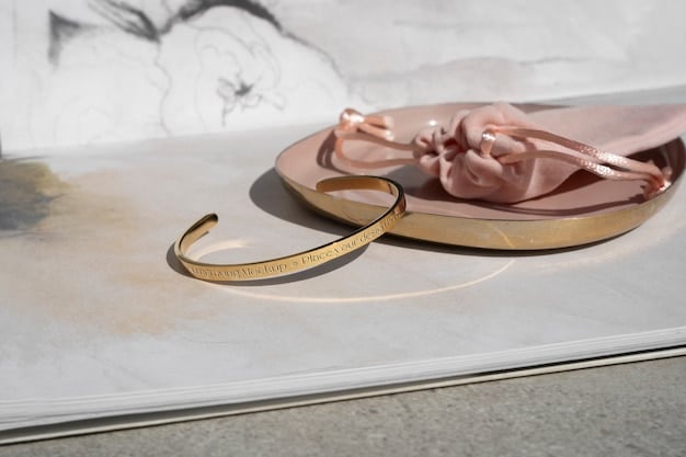 A flat lay image showcasing various accessories, including a silver bracelet, a gold watch, rose gold stud earrings, and a multi-metal ring. The accessories are arranged artfully on a neutral background.