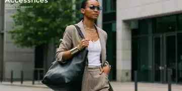 Stylish woman showcasing 2026 accessory trends with oversized tote and futuristic eyewear